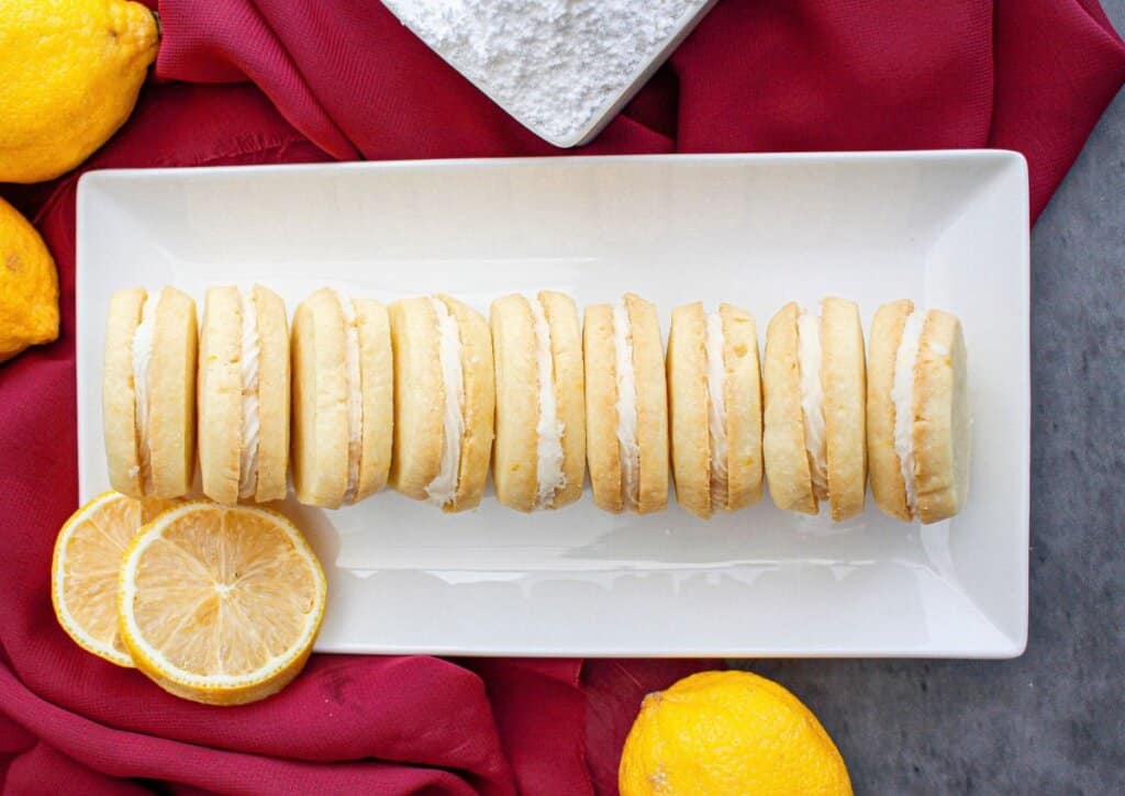 Lemon meltaway cookies on a white serving platter.