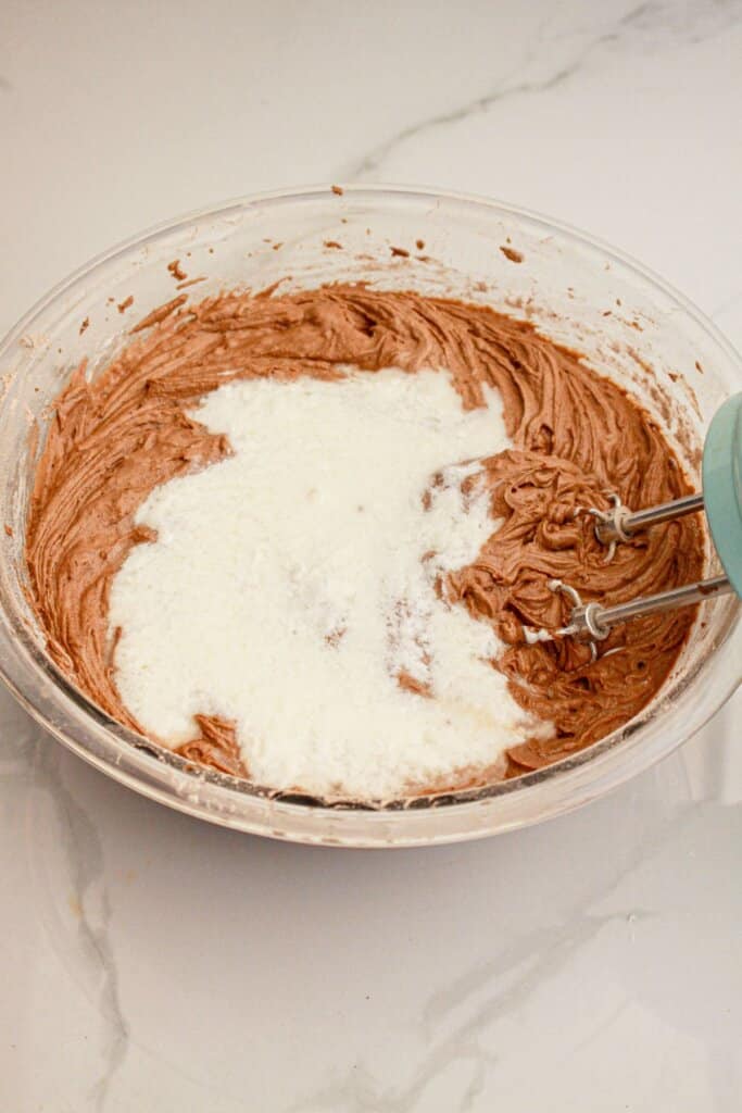 Buttermilk being added to batter.