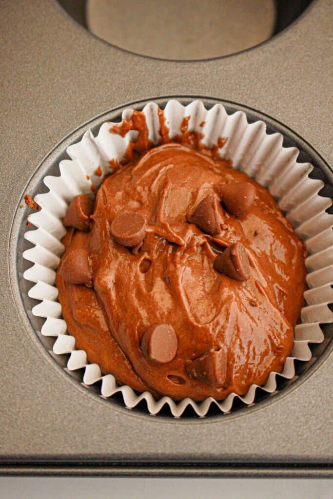 Chocolate batter in a cupcake pan.