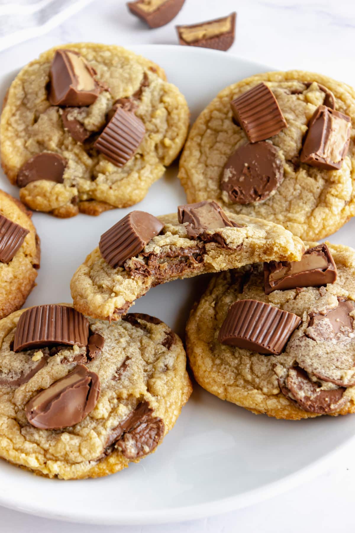 Peanut butter cup cookies on a white plate.