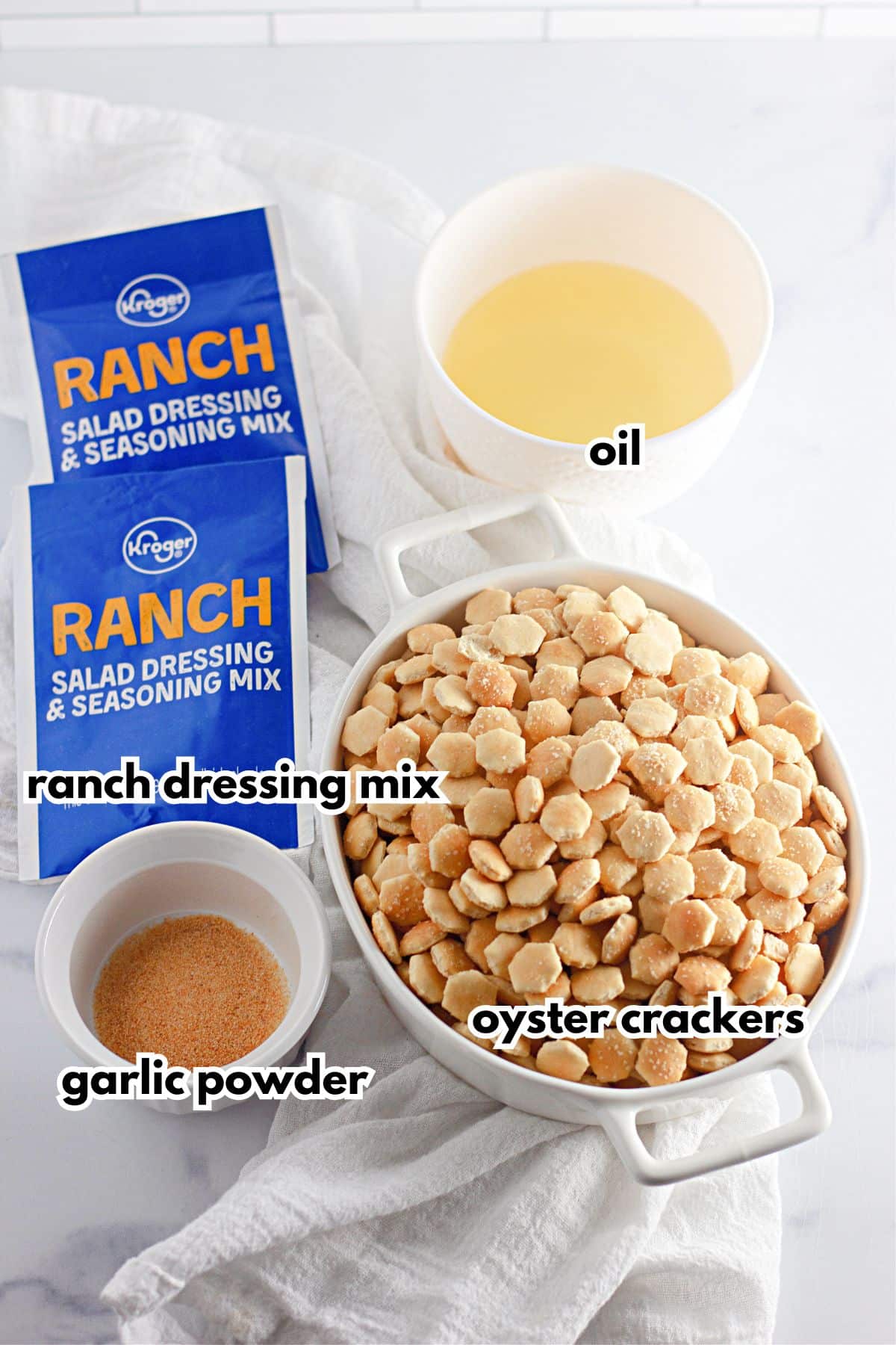 Ingredients labelled with text on a white counter.