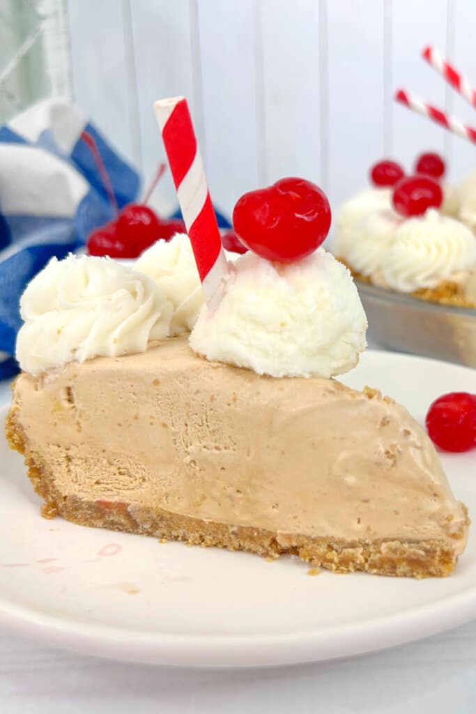 Slice of root beer pie on a plate.