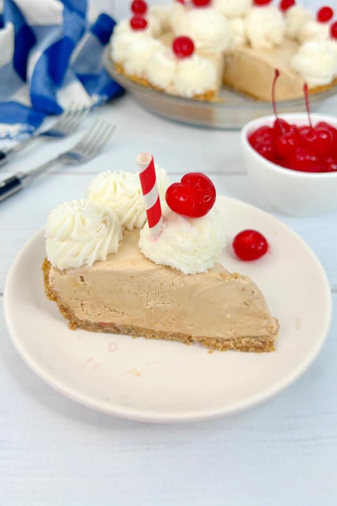 Slice of root beer pie on a plate.