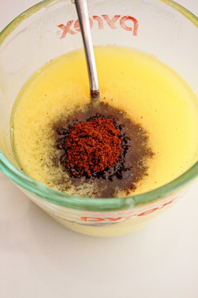 Espresso being mixed with melted butter.
