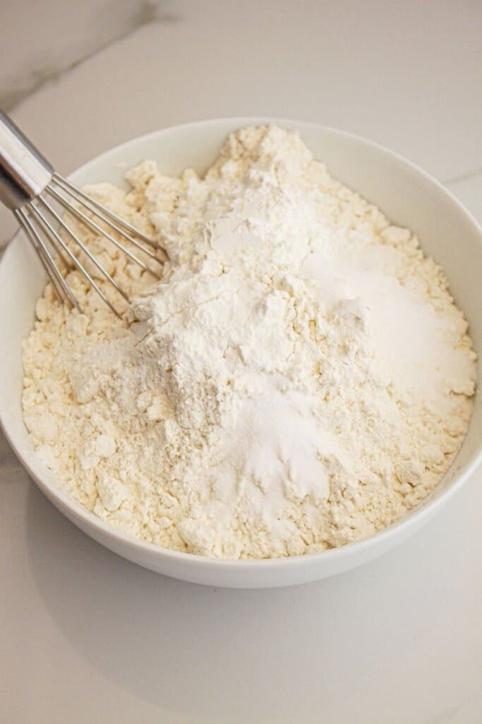 Dry ingredients being mixed in a bowl.