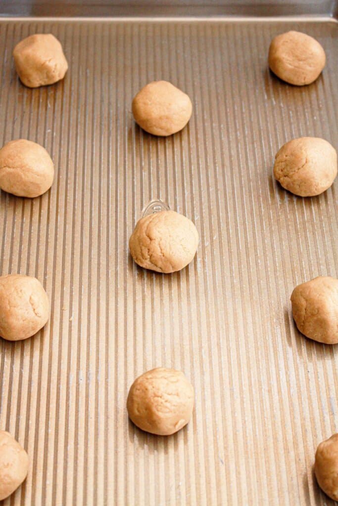 Dough balls on a baking sheet.