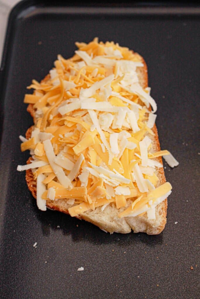 Cheese on a piece of bread.