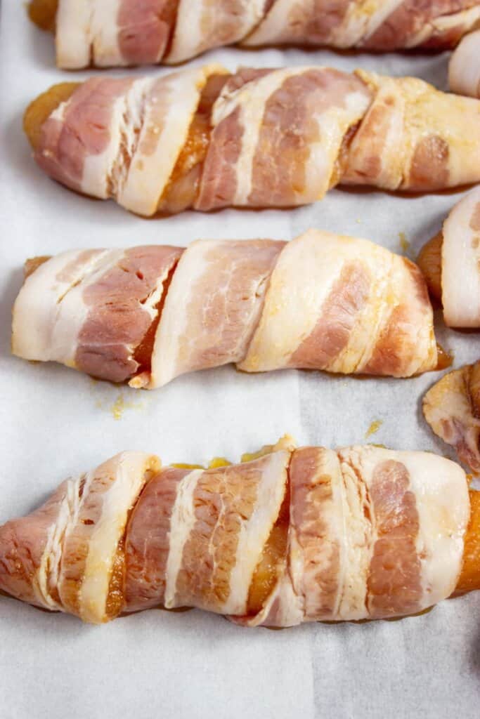 Meat on a parchment lined baking sheet.