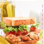 Blackened chicken club sandwiches on a counter.