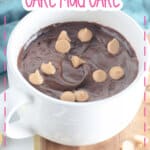 White coffee mug filled with chocolate cake.