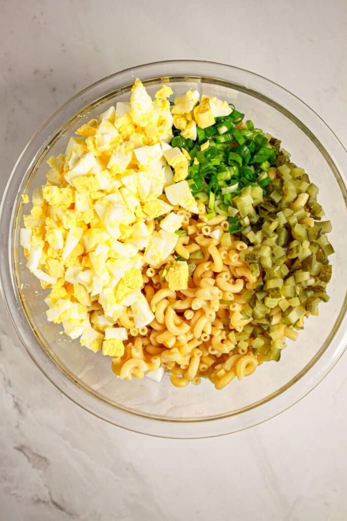 Ingredients ready to be mixed in a large glass bowl.