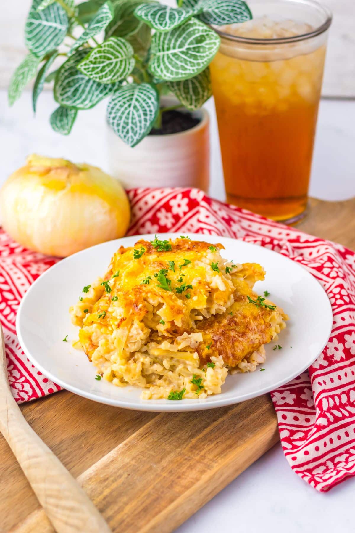 Serving of french onion chicken and rice on a plate.