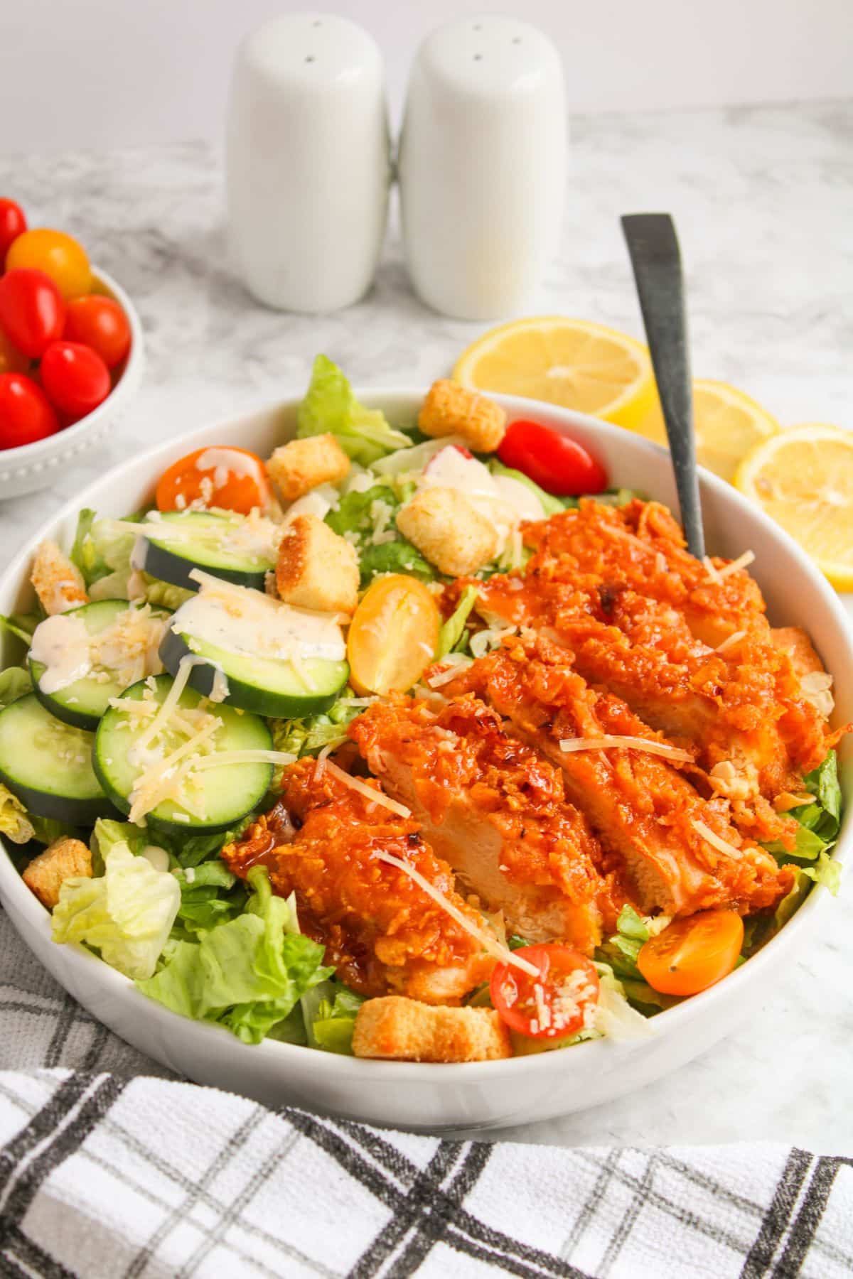 White bowl filled with hot honey chicken salad.