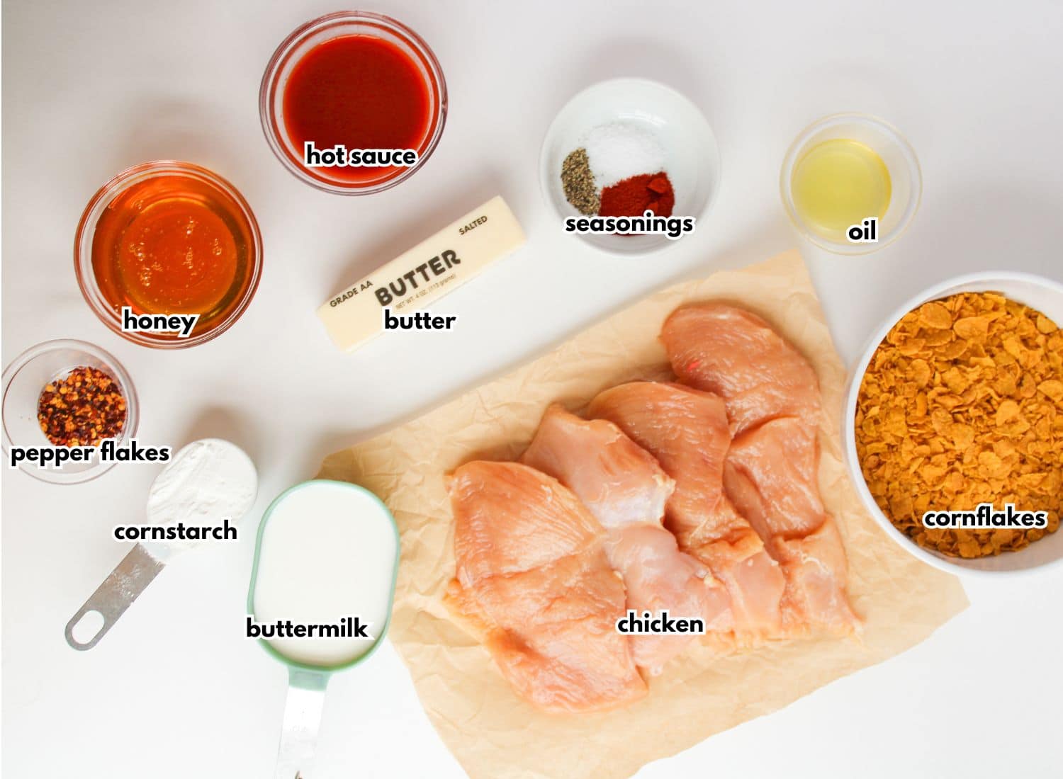 Bowls of ingredients labelled with text on a counter.