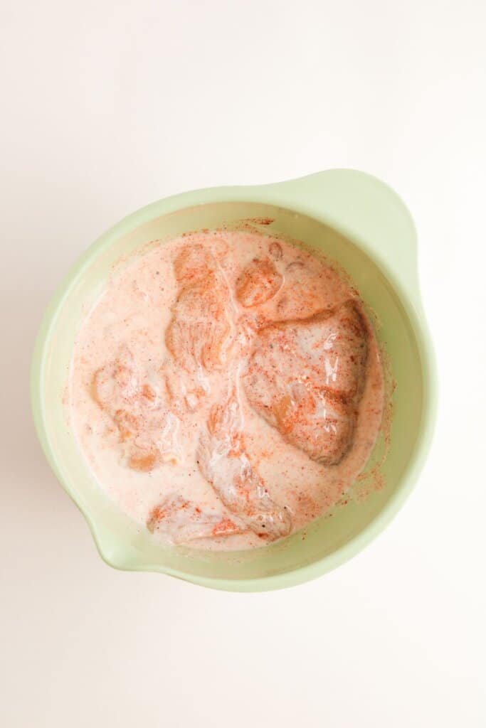 Chicken in a mixing bowl.