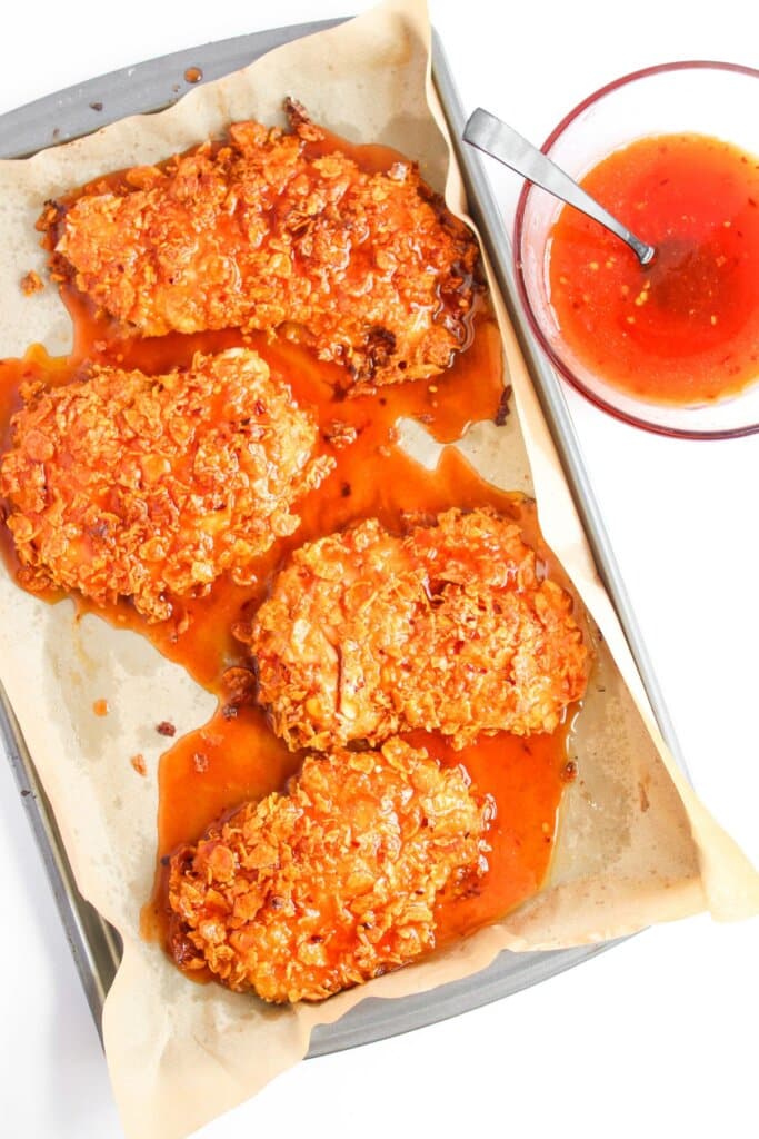 Hot honey chicken on baking sheet.