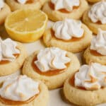 Lemon meringue cookies on a white plate.
