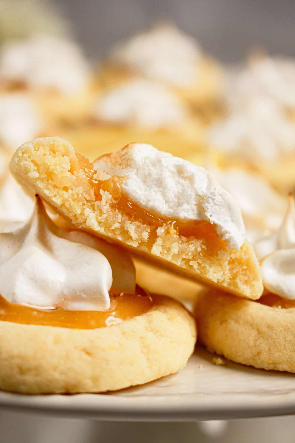 Lemon meringue cookies on a white plate.