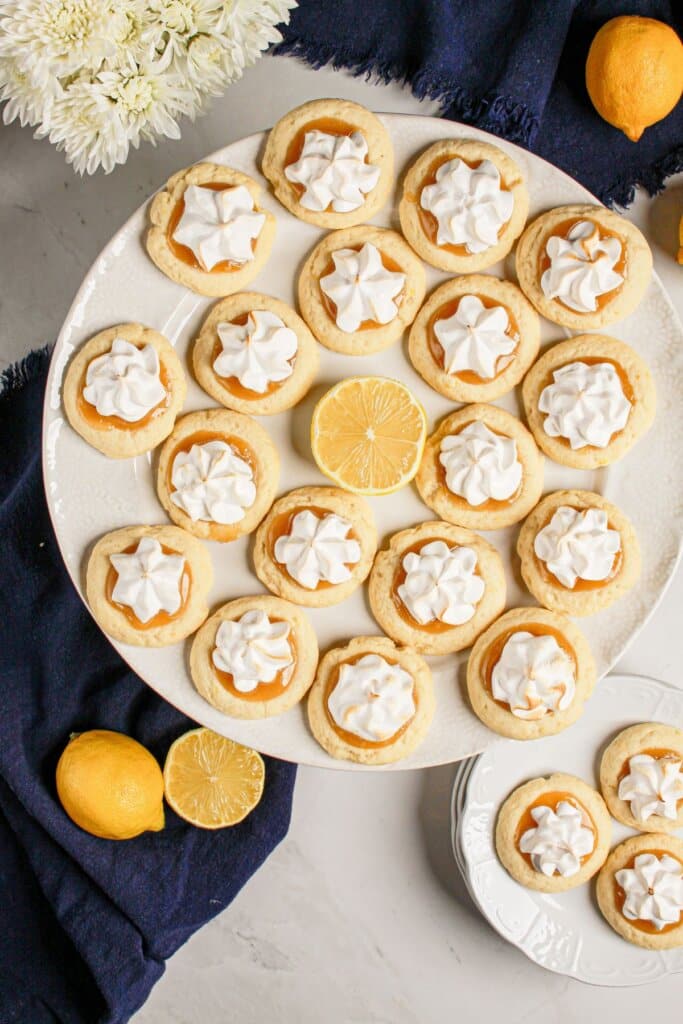 Lemon meringue cookies on a white plate.