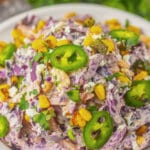 Large white bowl of mexican street corn coleslaw.