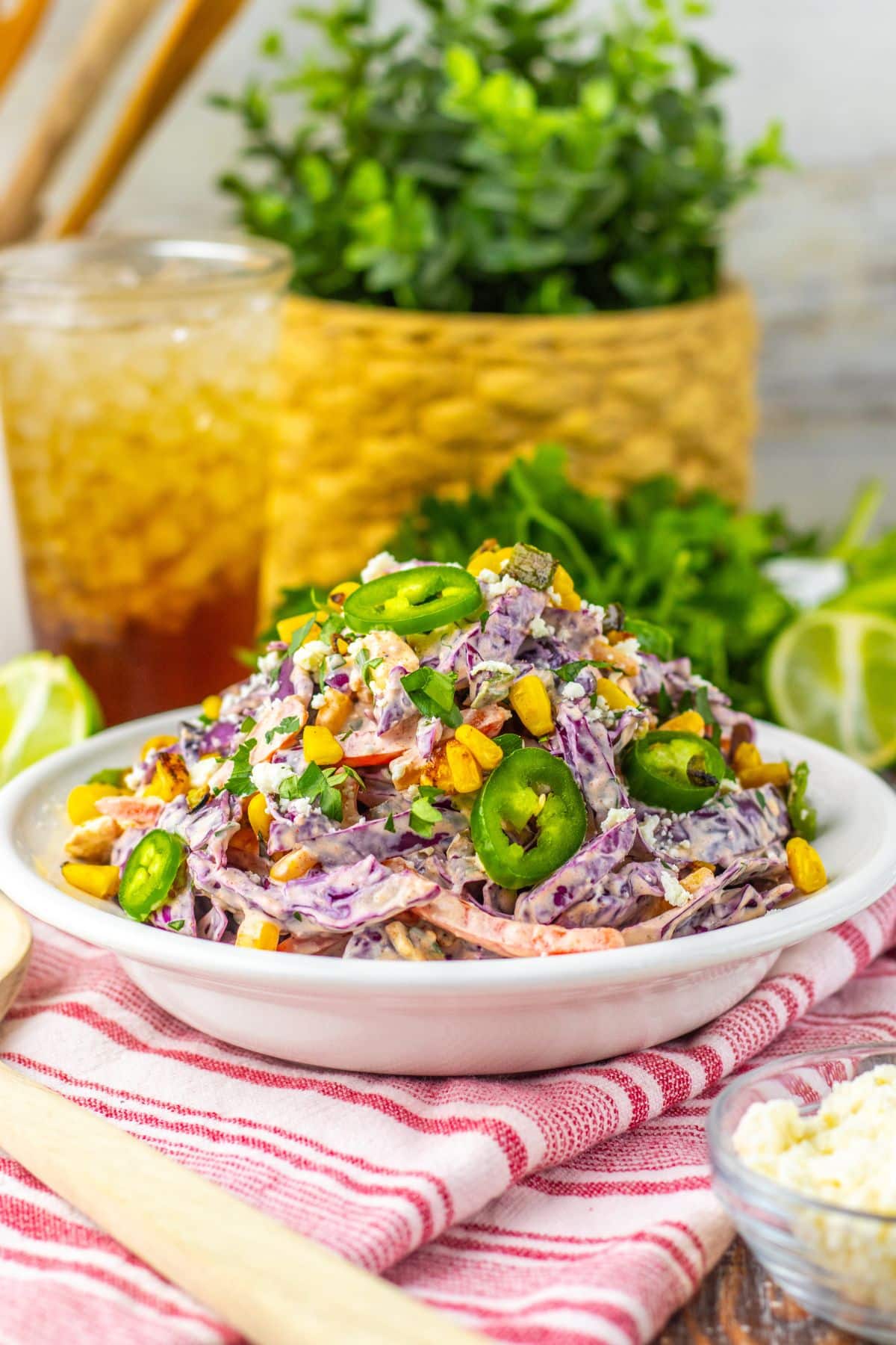 Large white bowl of mexican street corn coleslaw.