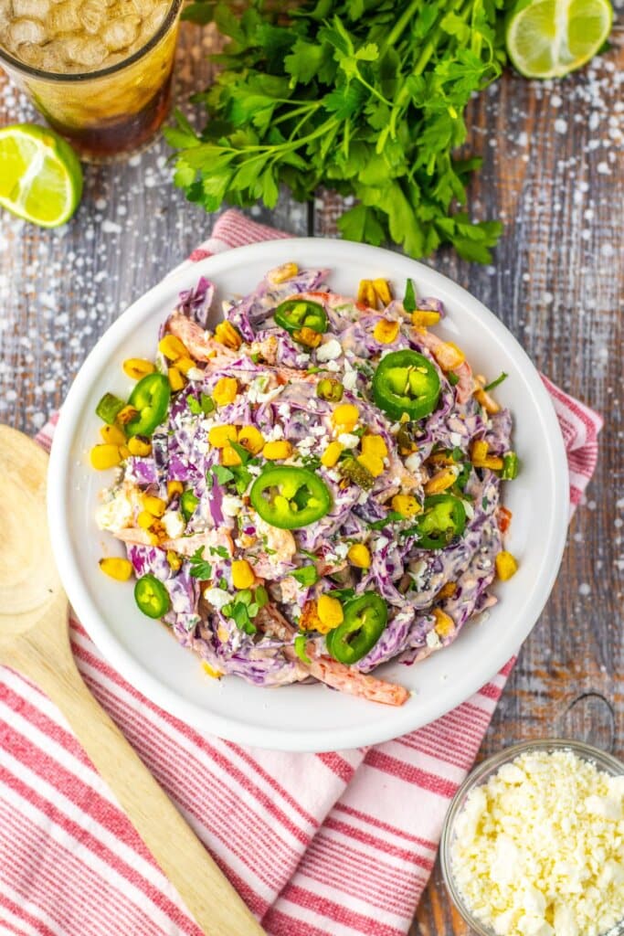 Large white bowl of mexican street corn coleslaw.