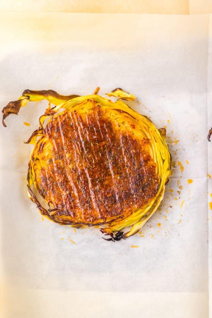 Toasted vegetable on a piece of parchment paper.