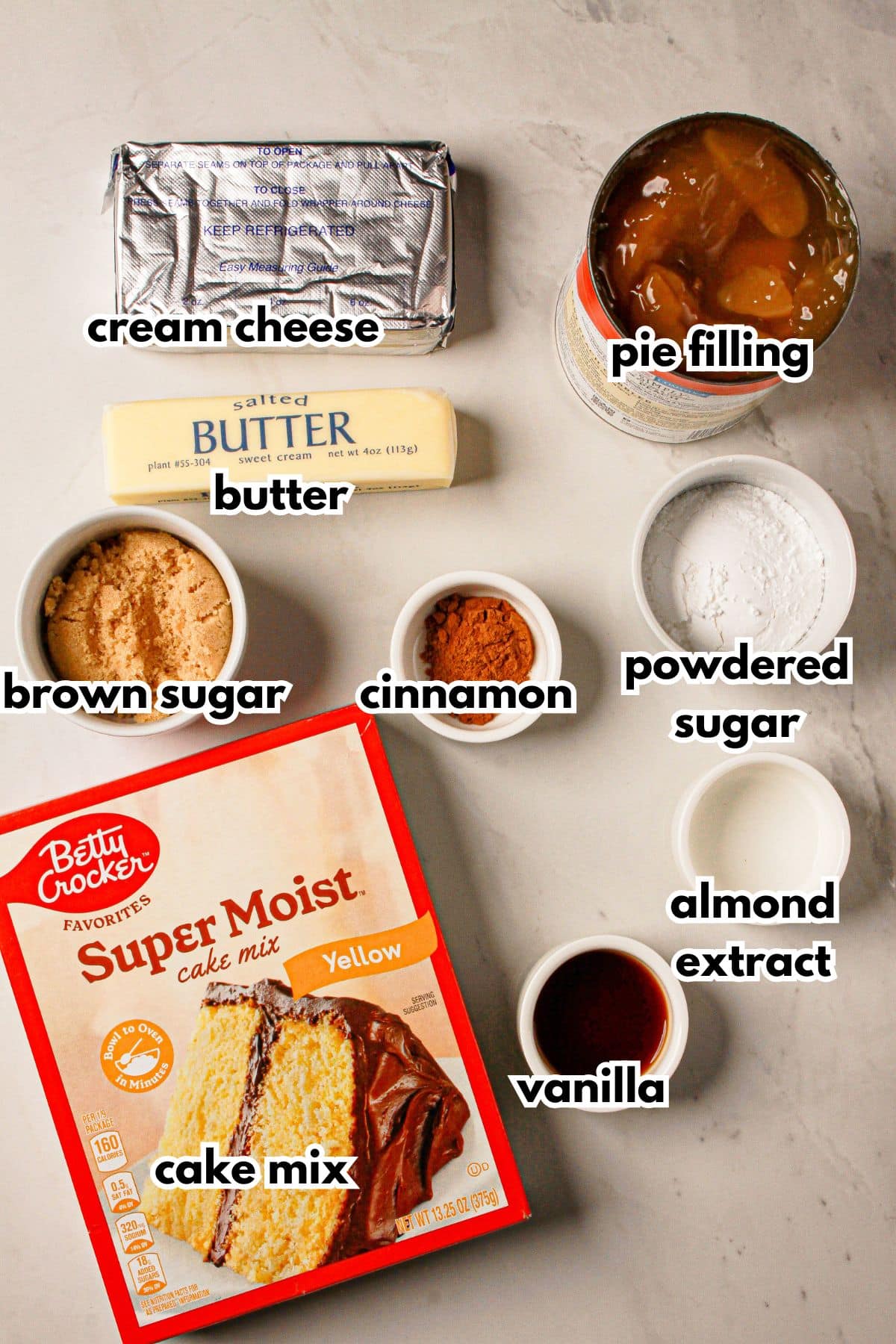 Bowls of ingredients labelled with text on a counter.