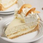 Slice of banana pudding cheesecake on a plate.