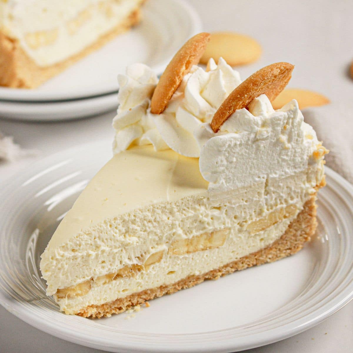 Slice of banana pudding cheesecake on a plate.