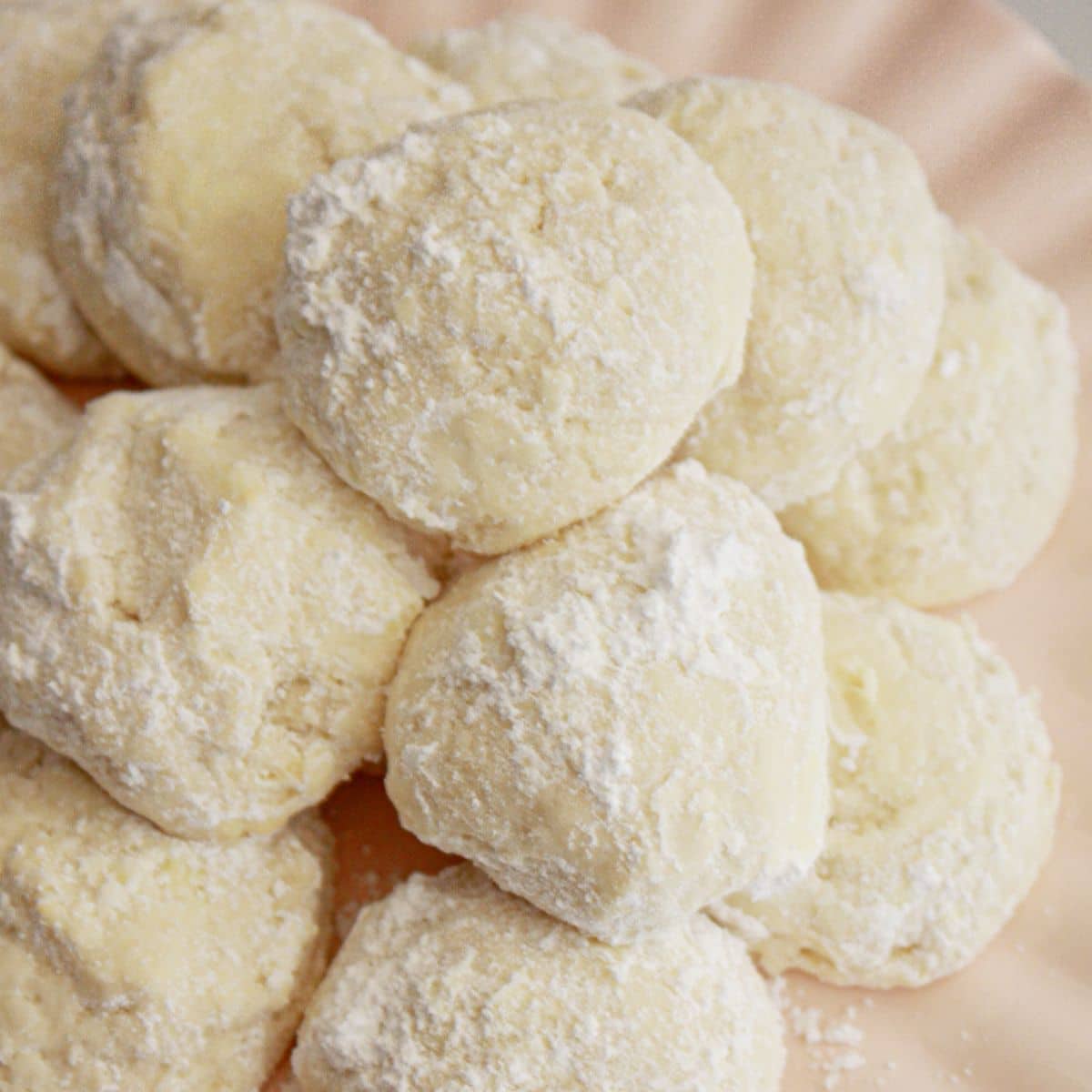 Plate full of cream cheese cookies.