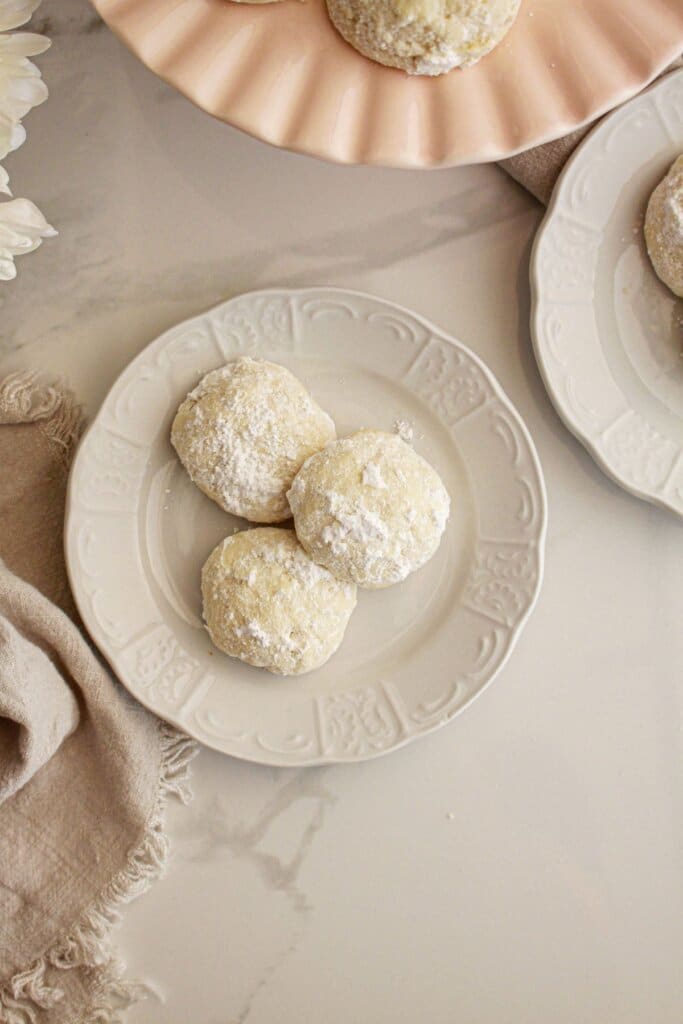 Snowball cookies on a plate.