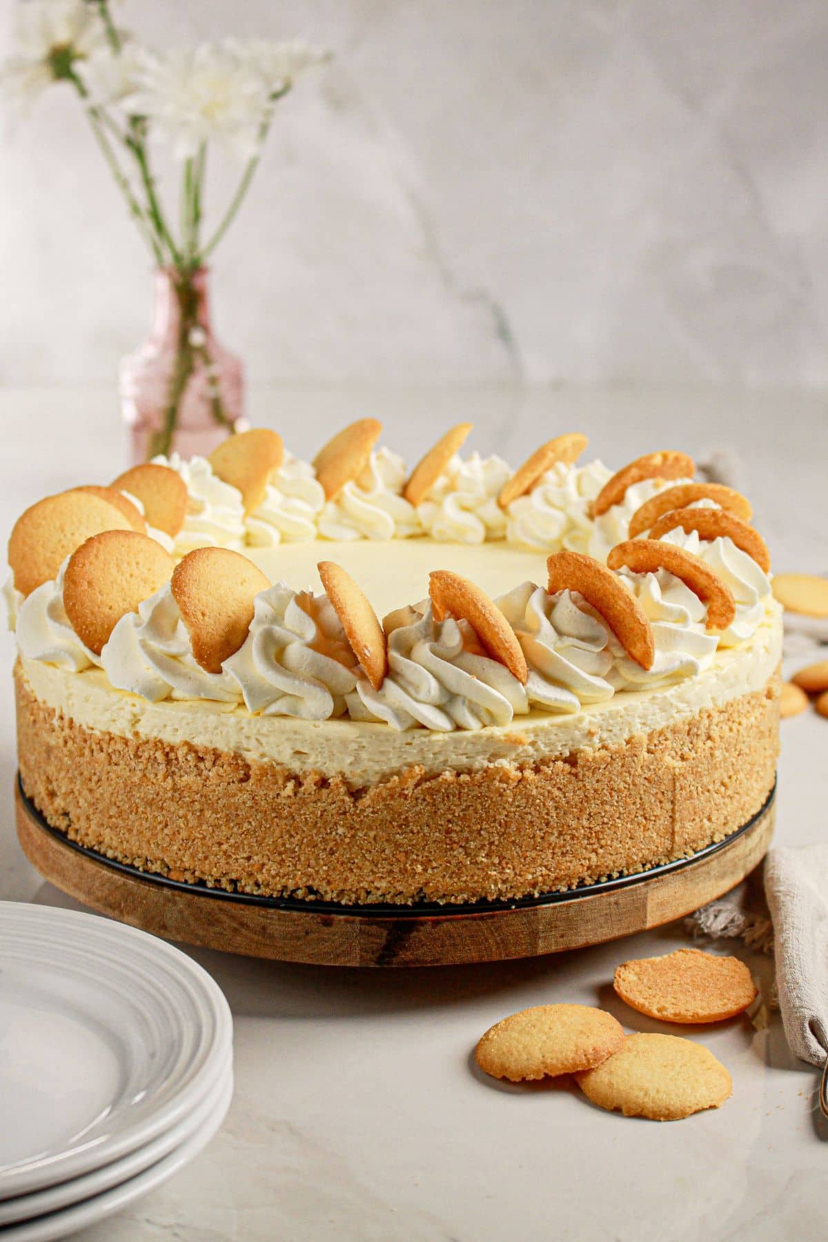 Whole cheesecake on a serving tray.