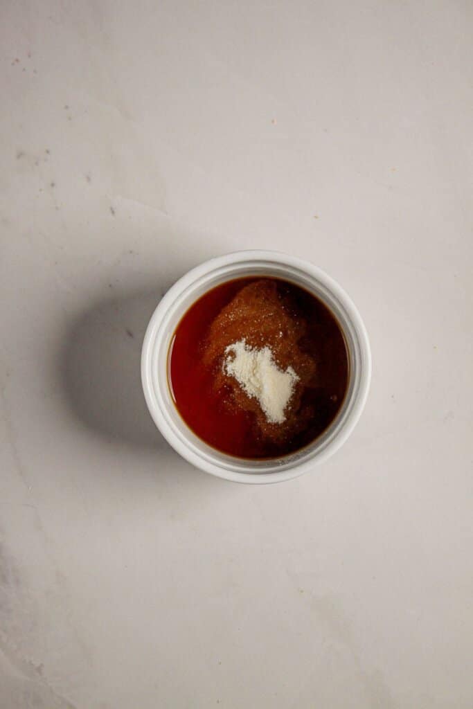 Vanilla extract and gelatin being mixed together.