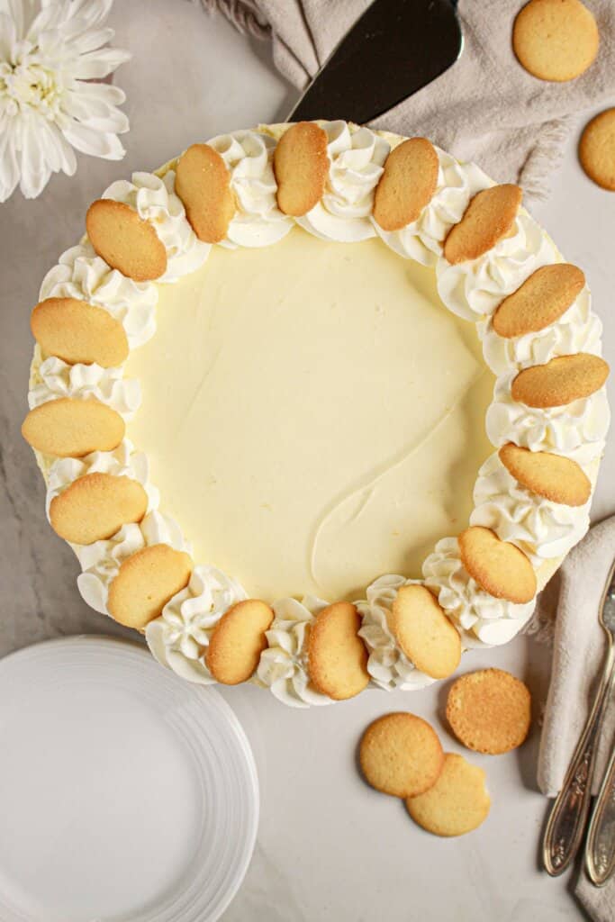 Full cheesecake on a serving plate.