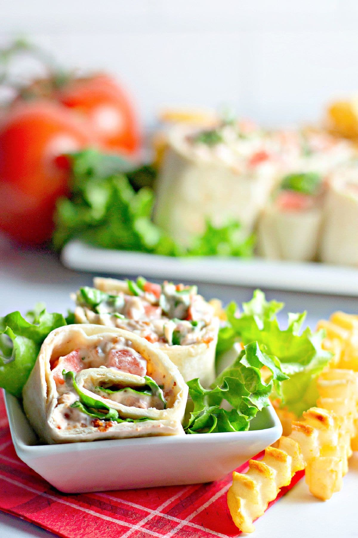 BLT roll ups on a plate.
