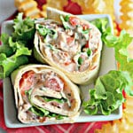 BLT roll ups on a plate.