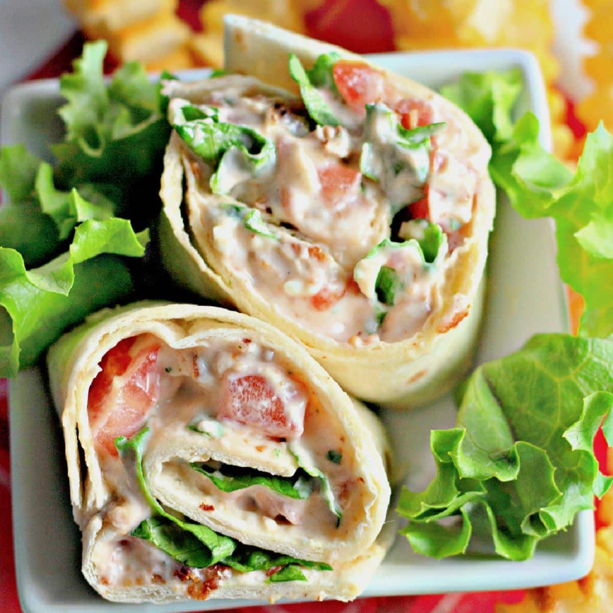 BLT roll ups on a plate.