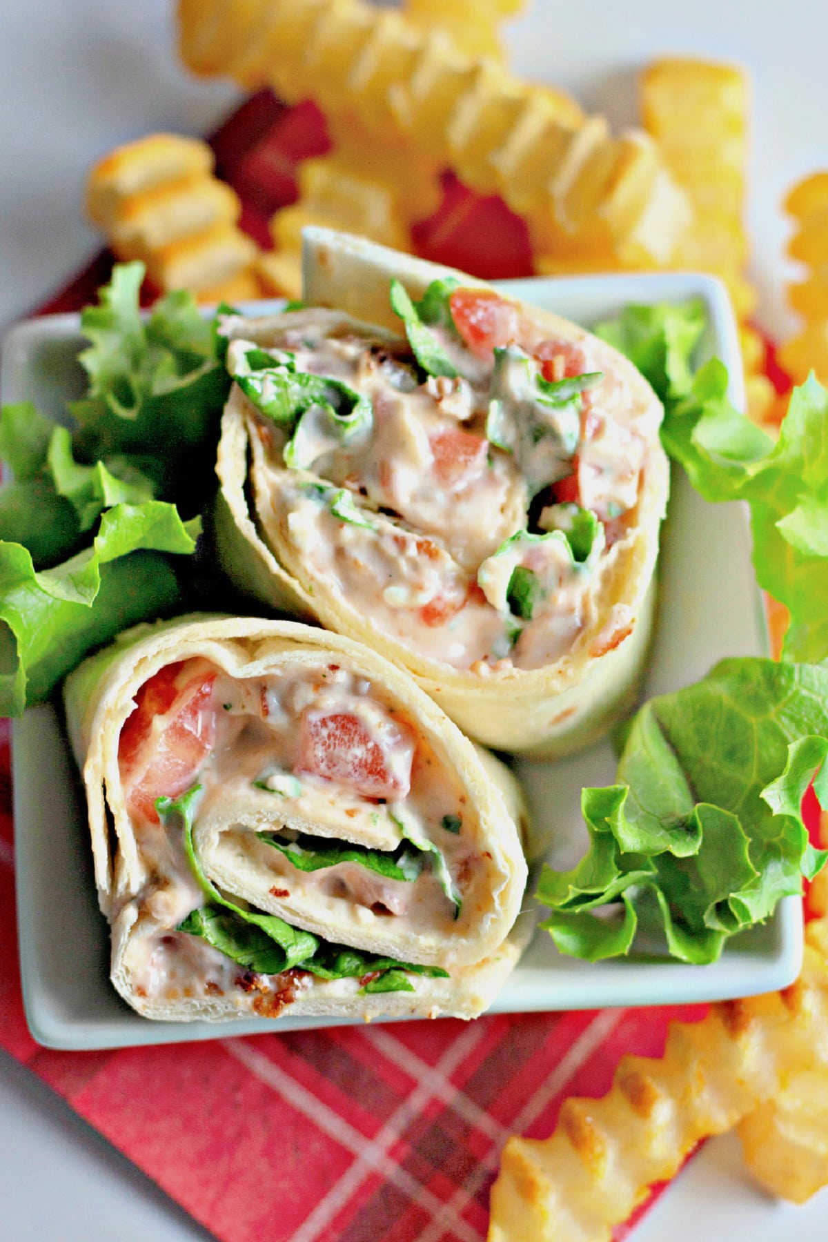 BLT roll ups on a plate.