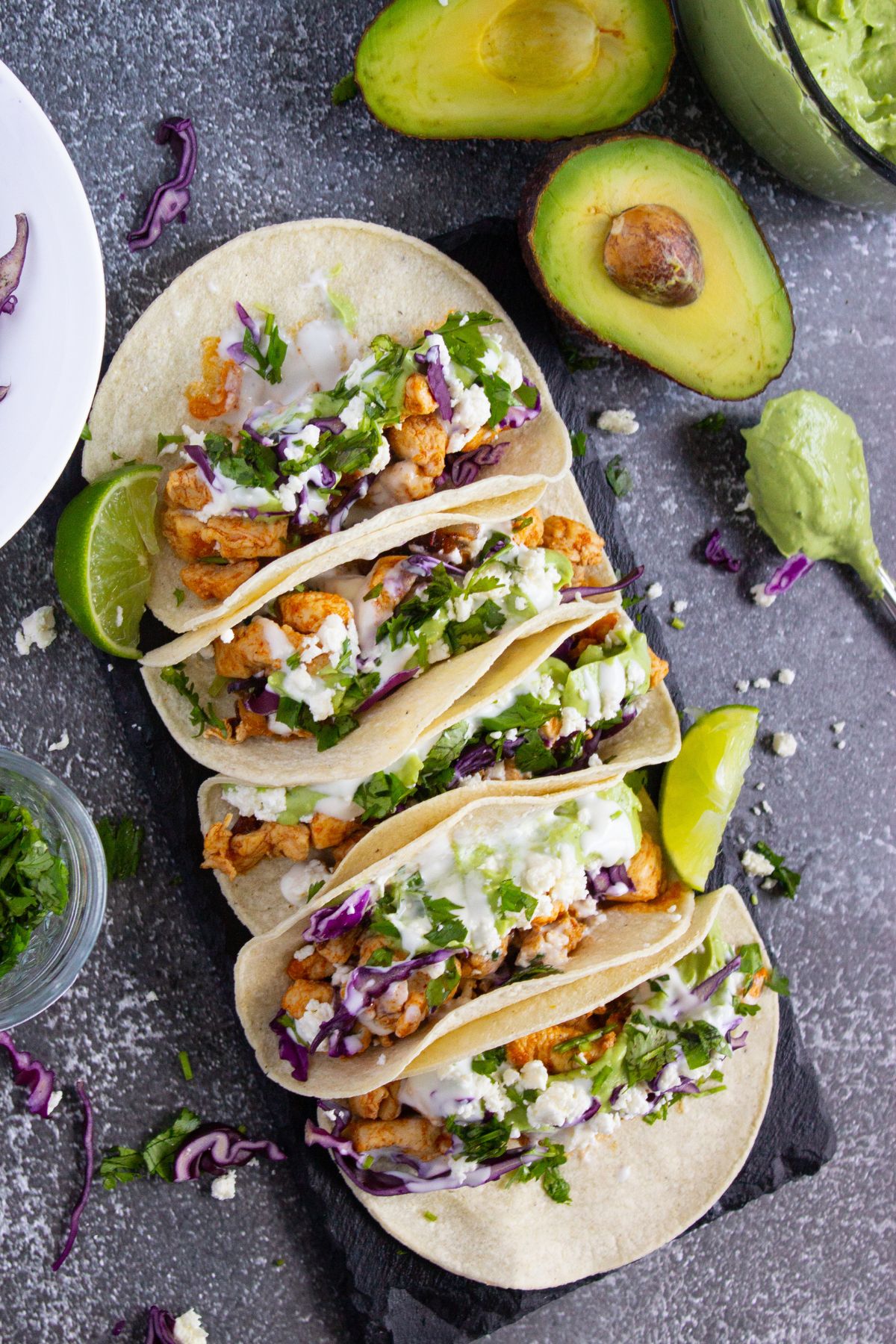 Chipotle chicken tacos on a serving board.