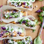 Chipotle chicken tacos on a serving board.