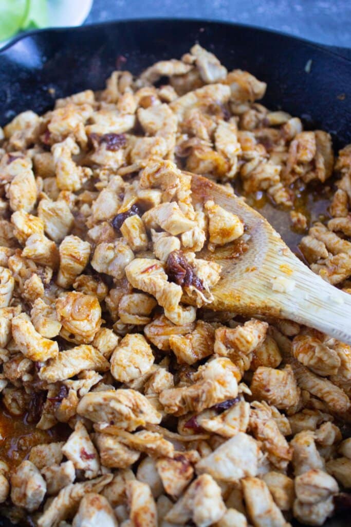 Cooked meat in a large cast iron skillet.