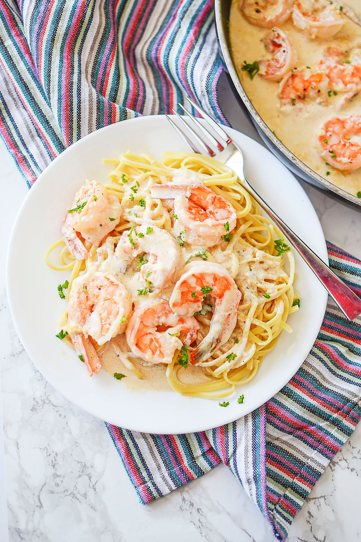 Plate full of creamy garlic shrimp.