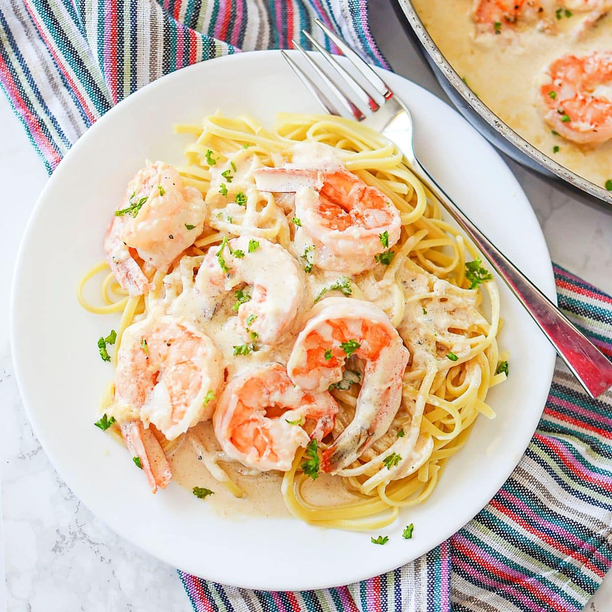 Plate full of creamy garlic shrimp.