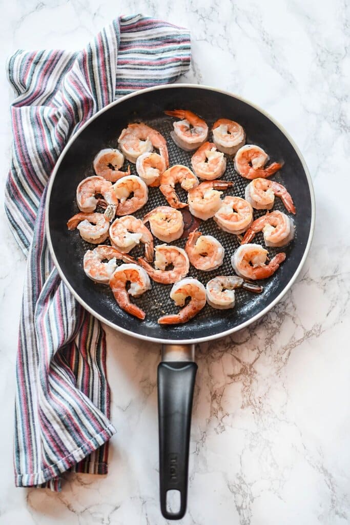 Shrimp in a large skillet.