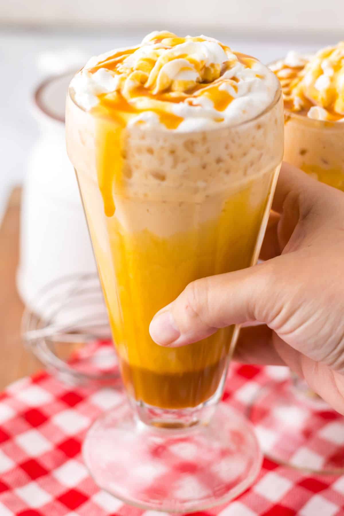 Glass full of frozen butterbeer.