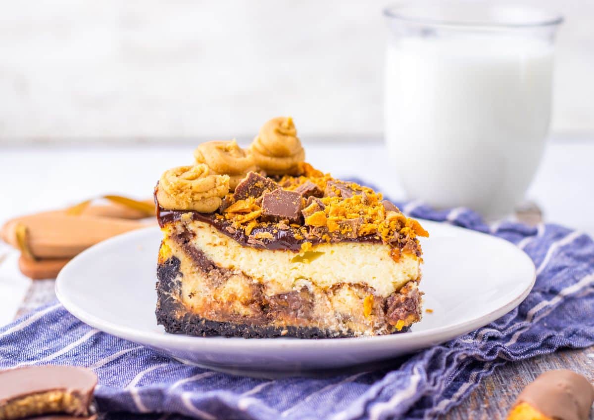 Slice fudge ripple cheesecake on a plate.