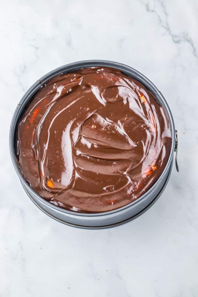 Chocolate ganache on top of cheesecake.