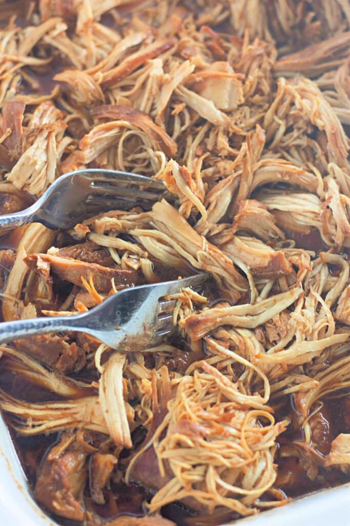 Shredded meat in a crock pot.