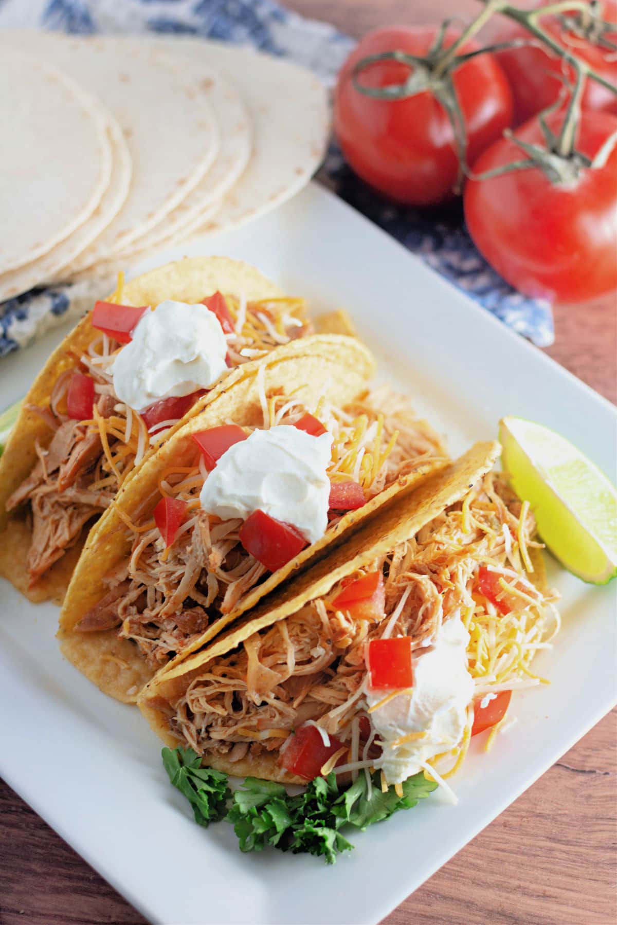 Plate with mexican shredded chicken tacos.